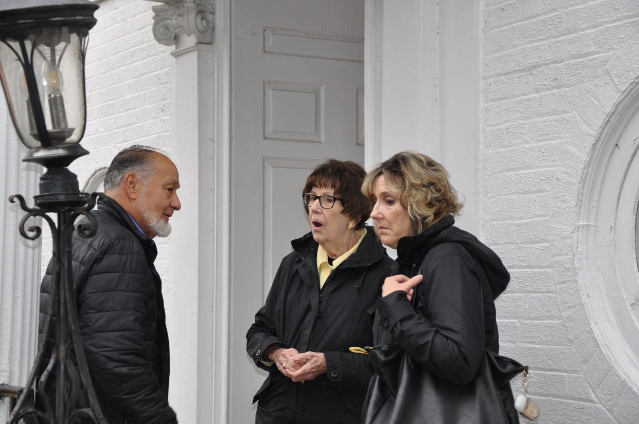Alliance residents Nick Hustus, Annette Beltrami and Judi Brush tour the former William H. Morgan Jr. mansion, which was sold at auction on Wednesday. Seller Carol Fleisher had lived there 35 years.