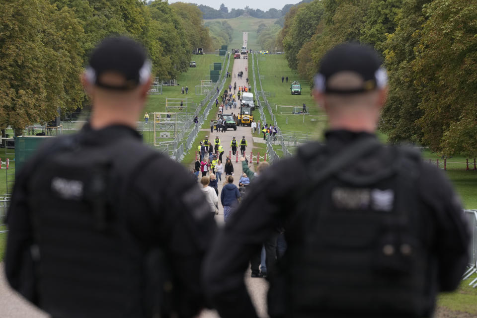 British policemen patrol the Long Walk outside Windsor Castle in Windsor, England, Thursday, Sept. 15, 2022. Queen Elizabeth II will lie in state in Westminster Hall for four full days before her funeral on Monday Sept. 19. (AP Photo/Gregorio Borgia)