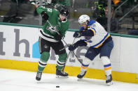 Dallas Stars defenseman Thomas Harley (55) and St. Louis Blues center Robert Thomas (18) compete for the puck during the second period of an NHL hockey game in Dallas, Wednesday, April 17, 2024. (AP Photo/Tony Gutierrez)