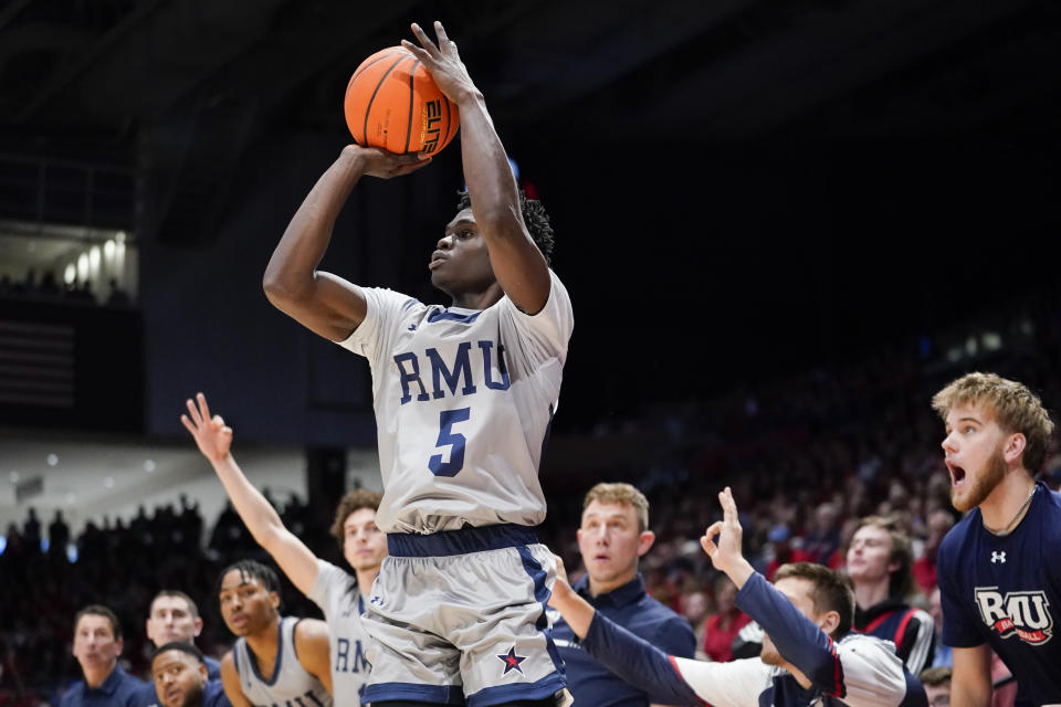 Robert Morris guard Enoch Cheeks (5) shoots a 3-pointer during the second half of an NCAA college basketball game, Saturday, Nov. 19, 2022, in Dayton, Ohio. (AP Photo/Joshua A. Bickel)