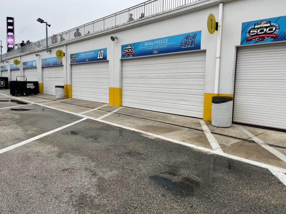 Puddles of water outside the mostly unoccupied NASCAR Cup Series garages on Saturday, Feb. 17, afternoon at Daytona International Speedway.