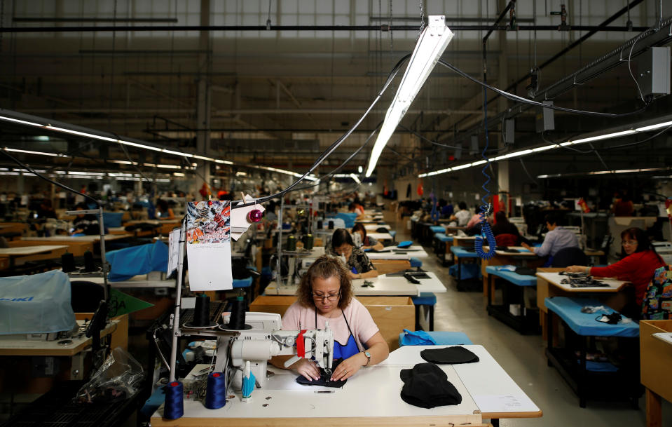 Workers make jackets at the Canada Goose factory in Toronto, Ontario, Canada, February 23, 2018.   REUTERS/Mark Blinch