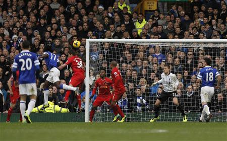 Everton's Romalu Lukaku (L) scores a goal against Liverpool during their English Premier League soccer match at Goodison Park in Liverpool, northern England November 23, 2013. REUTERS/Phil Noble