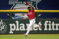 Texas Rangers center fielder Adolis Garcia makes a running catch on a fly out by Washington Nationals' Juan Soto in the first inning of a baseball game, Friday, June 24, 2022, in Arlington, Texas. (AP Photo/Tony Gutierrez)