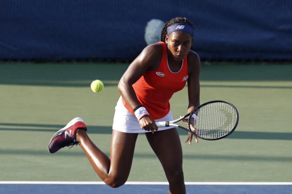 Cori Gauff returns the ball as she and Caty McNally played against Fanny Stollar, of Hungary, and Maria Sanchez in the women's doubles final at the Citi Open tennis tournament Saturday, Aug. 3, 2019, in Washington. (AP Photo/Patrick Semansky)