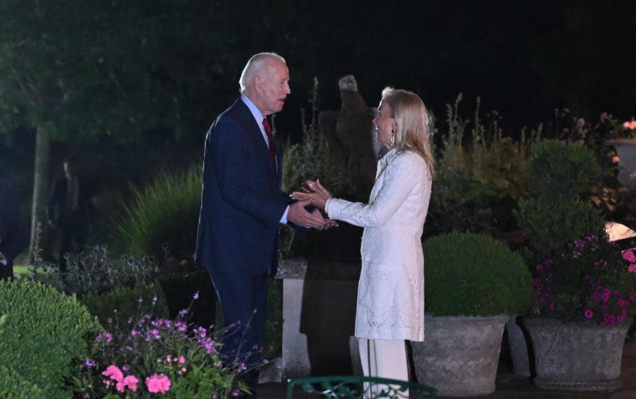 US President Joe Biden speaks with Jane Hartley, Ambassador of the US to the United Kingdom, while arriving at Winfield House Landing Zone in London on July 9, 2023.