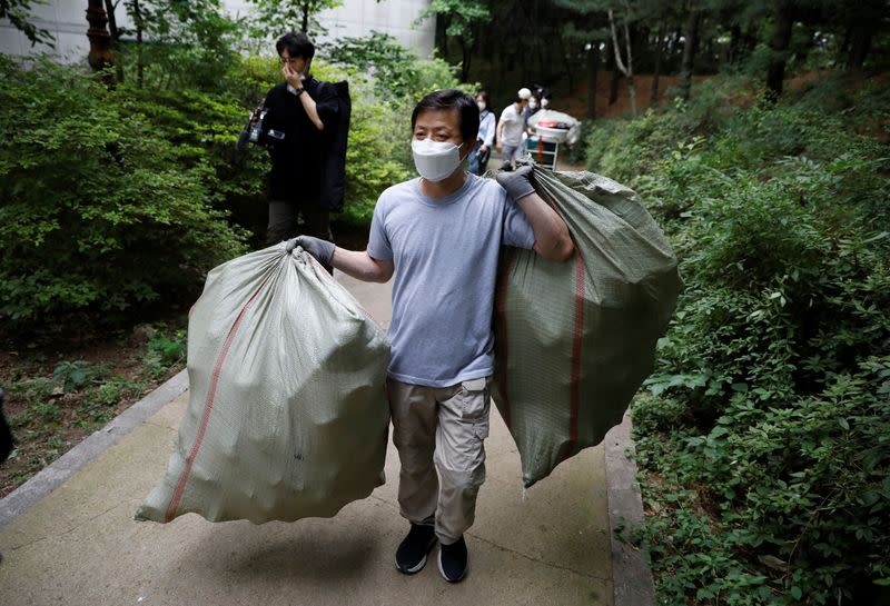 North Korean defector group prepares plastic bottles filled with rice and masks to be sent towards North Korea