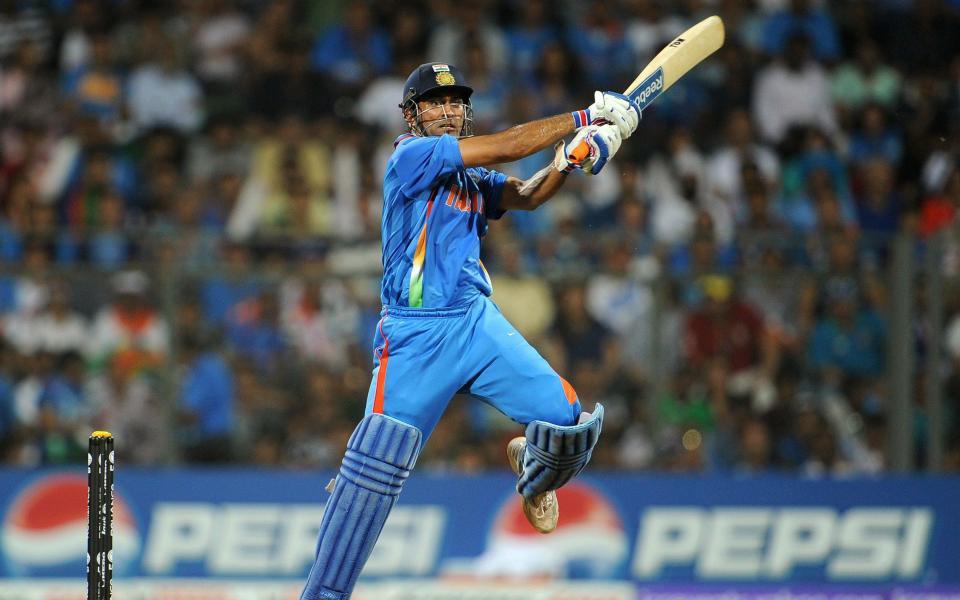 indian batsman Mahendra Singh Dhoni hits...Indian batsman Mahendra Singh Dhoni hits a drive off the back foot from the Sri Lankan bowling during the ICC Cricket World Cup 2011 final played at The Wankhede Stadium in Mumbai on April 2, 2011 - GETTY IMAGES