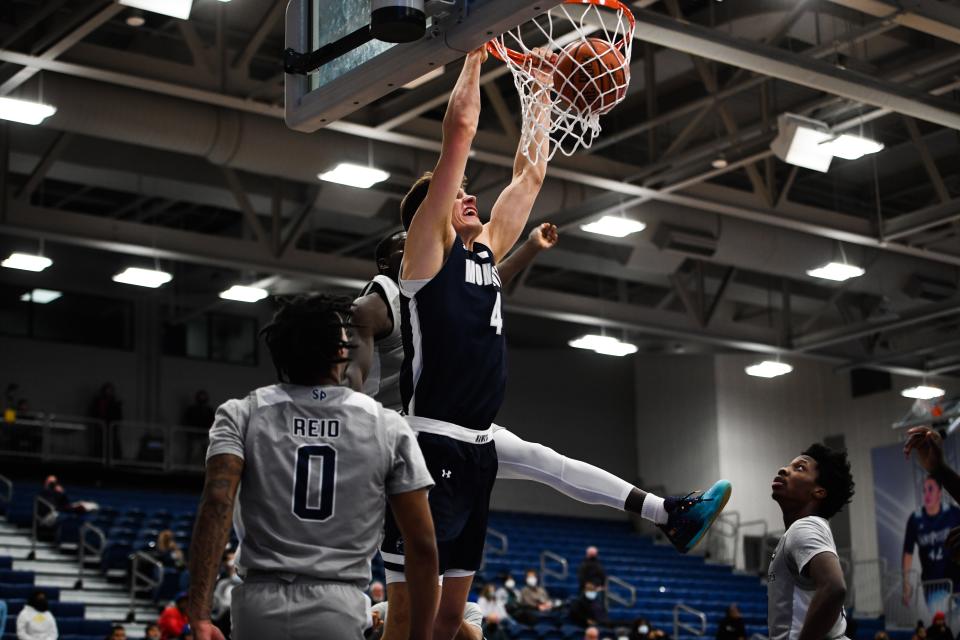 Monmouth's Walker Miller dunks against Saint Peter's on Jan. 14, 2022 in Jersey City.