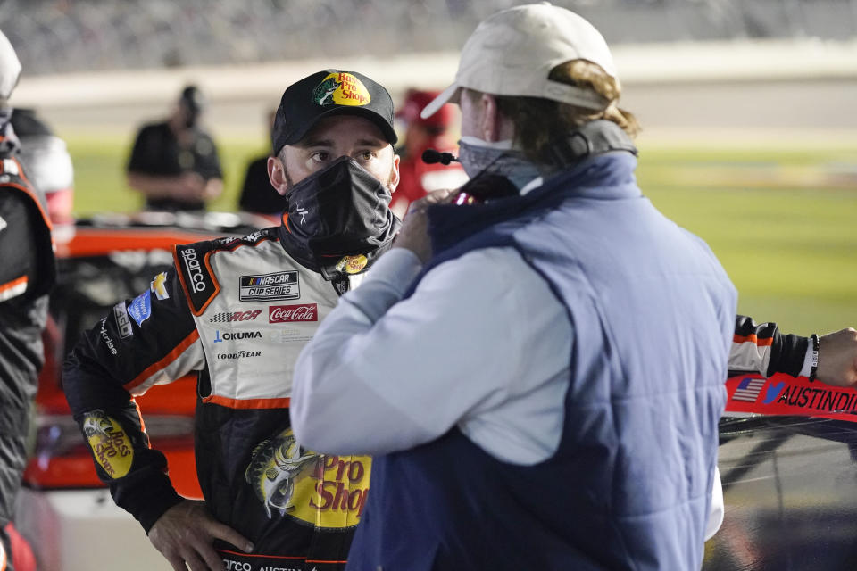 Austin Dillon, left, talks with car owner Richard Childress on pit road before the start of the second of two qualifying NASCAR auto races for the Daytona 500 at Daytona International Speedway, Thursday, Feb. 11, 2021, in Daytona Beach, Fla. (AP Photo/John Raoux)