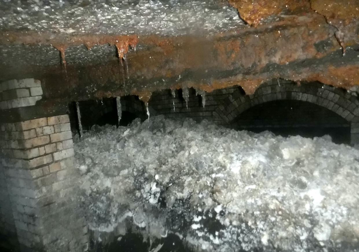 Images of a fatberg 210ft long found beneath the streets of Sidmouth. A water boss has revealed more affluent areas are more likely to be affected as residents prefer sturdier quilted toilet paper. (SWNS)