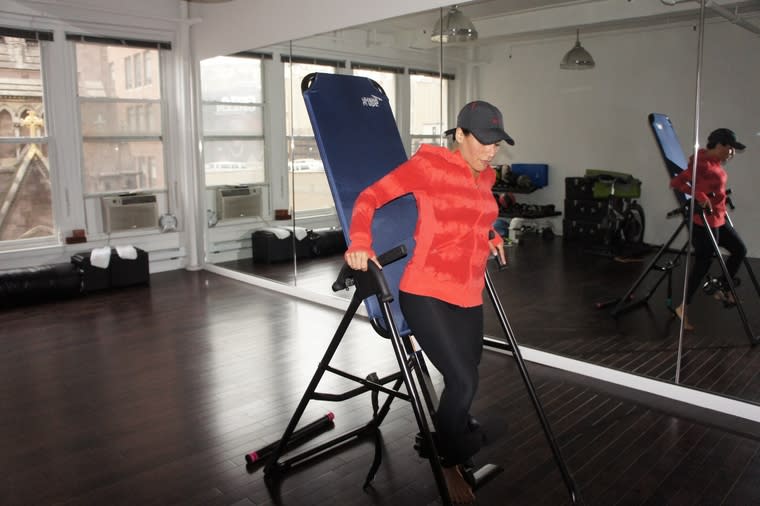 Ary getting herself strapped into the inversion table. She was very adamant about NOT try this at…