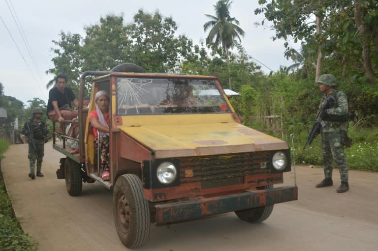 Philippine marines check a passenger jeepney at a check point in Indanan town in Sulu province on the southern island of Mindanao on February 27, 2017