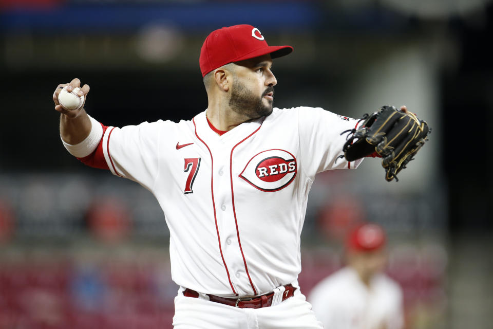 Cincinnati Reds' Eugenio Suarez throws out a runner against the Washington Nationals during the eighth inning of a baseball game Thursday, Sept. 23, 2021, in Cincinnati. The Nationals beat the Reds 3-2. (AP Photo/Jay LaPrete)