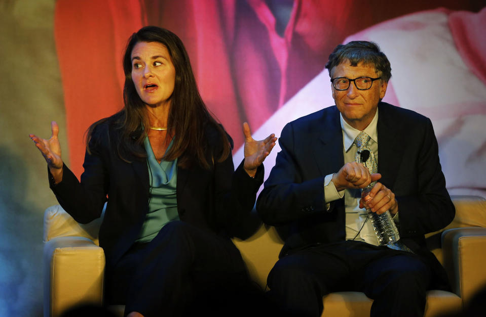 Melinda Gates, left, talks to Indian author Chetan Bhagat, unseen, as Bill Gates looks at the audience in Sep. 2019 during an interaction organized by the Bill and Melinda Gates foundation in New Delhi, India. 