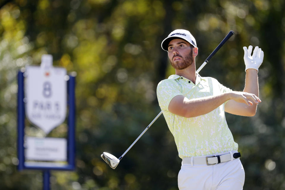 Matthew Wolff lets go of his driver in reaction as his tee shot on the eighth hole goes left into the rough during the final round of the Houston Open golf tournament Sunday, Nov. 14, 2021, in Houston. (AP Photo/Michael Wyke)