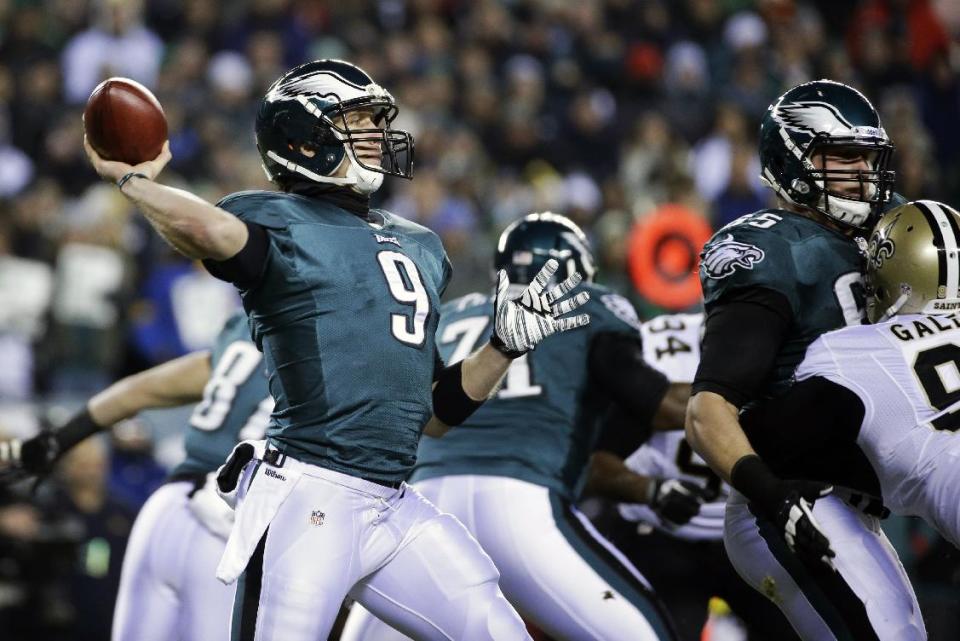 Philadelphia Eagles' Nick Foles drops back during the first half of an NFL wild-card playoff football game against the New Orleans Saints, Saturday, Jan. 4, 2014, in Philadelphia. (AP Photo/Matt Rourke)