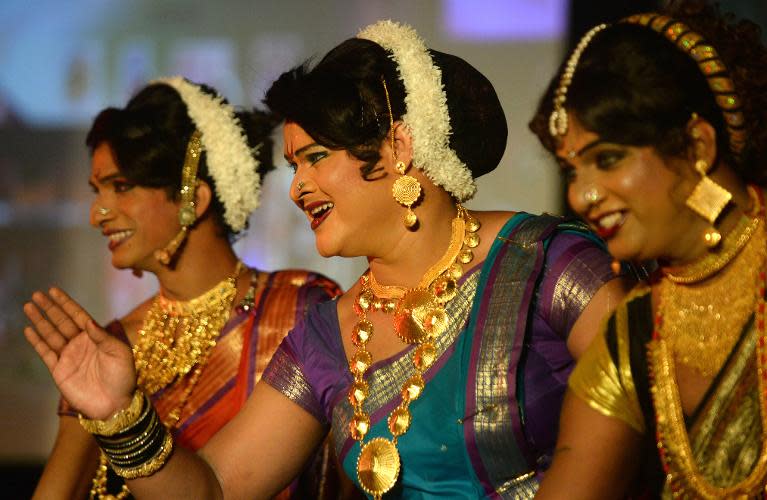 Indian transgenders perform at a seminar in Mumbai on October 3, 2013