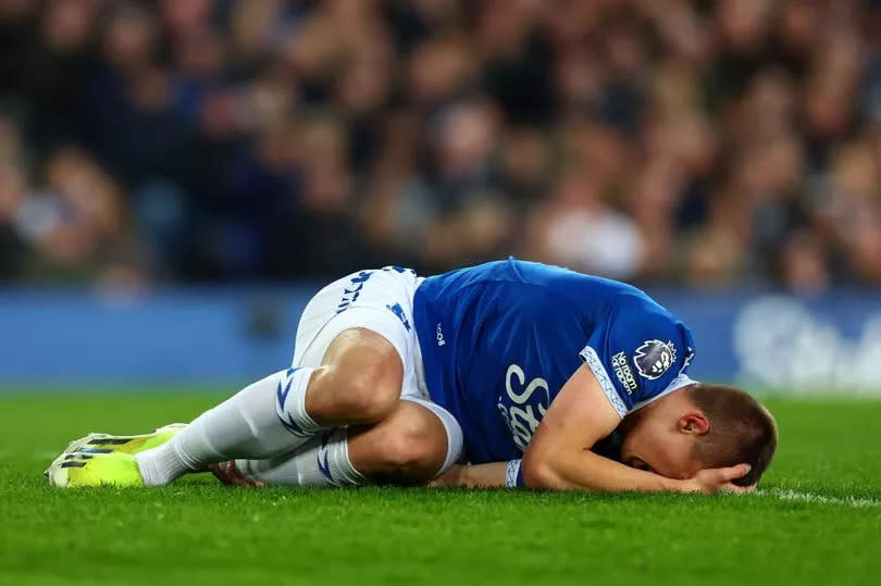 LIVERPOOL, ENGLAND - APRIL 24: Vitaliy Mykolenko of Everton lies injured the Premier League match between Everton FC and Liverpool FC at Goodison Park on April 24, 2024 in Liverpool, England. (Photo by Chris Brunskill/Fantasista/Getty Images)