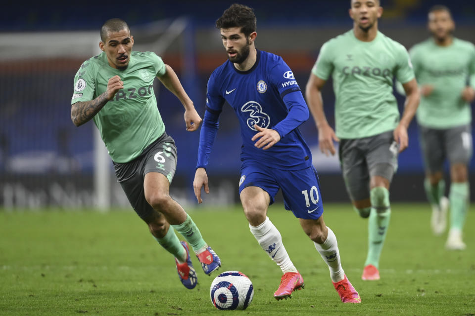 Chelsea's Christian Pulisic, right, is challenged by Everton's Allan during the English Premier League soccer match between Chelsea and Everton at the Stamford Bridge stadium in London, Monday, March 8, 2021. (Mike Hewitt/Pool via AP)