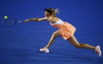 Russia's Maria Sharapova hits a shot during her fourth round match against Switzerland's Belinda Bencic at the Australian Open tennis tournament at Melbourne Park, Australia, January 24, 2016. REUTERS/Jason O'Brien Action Images via Reuters