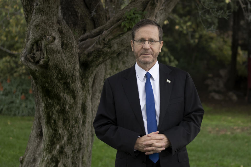 Israel's President Isaac Herzog poses for a portrait in the shade of an olive tree on the grounds of his official residence in Jerusalem, Thursday, Dec. 14, 2023. (AP Photo/Maya Alleruzzo)