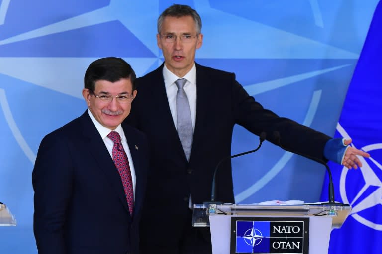 Turkish Prime Minister Ahmet Davutoglu, pictured at left with NATO Secretary-General Jens Stoltenberg on November 30, 2015, said Ankara was "protecting our airspace' in shooting down a Russian warplane and would not apologize for "doing our duty"