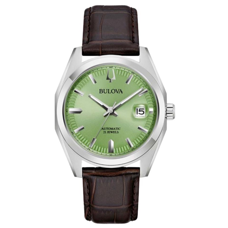silver watch with green face and leather strap