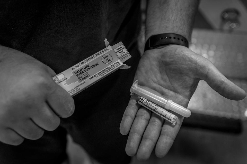 <p>A firefighter with Narcan at the MIddletown Fire Department. Before, reviving a victim only took 2 mg. Recently, they’ve had to administer as much as 18. (Photograph by Mary F. Calvert for Yahoo News) </p>