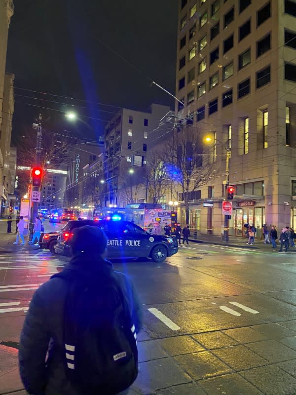 Police block a road following a shooting in Seattle