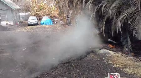 Steam rises from a new fissure in Puna, Hawaii, U.S. in this still image from video taken on May 8, 2018. Apau Hawaii Tours/Social Media via REUTERS