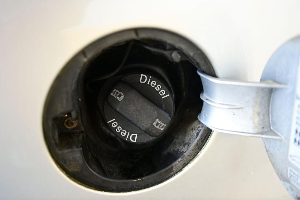 A photo taken on on Oct. 18, 2021, shows the tank cap of a vehicle running on diesel at a petrol station in Wendeburg, Germany.