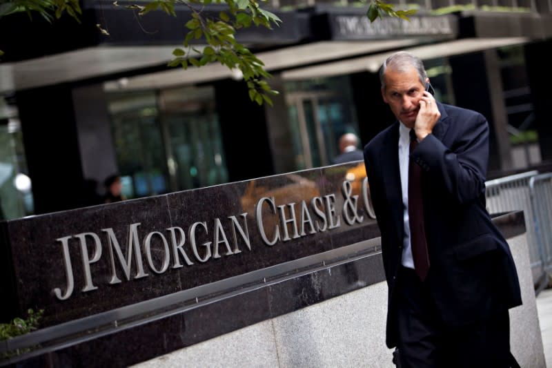 Man walks past JP Morgan Chase's international headquarters on Park Avenue in New York