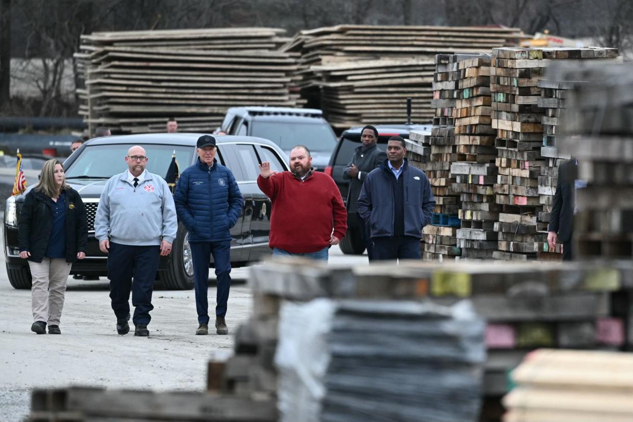 US President Joe Biden (C) listens as East Palestine Mayor Trent Conaway (2nd from R) speaks during an operational briefing from officials on the continuing response and recovery efforts at the site of a train derailment which spilled hazardous chemicals a year ago in East Palestine, Ohio on February 16, 2024. Also pictured are East Palestine Fire Chief Keith Drabick (2 from L) and US Environmental Protection Agency Administrator Michael Regan (R).