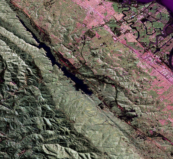 UAVSAR image of the San Andreas fault in the San Francisco Bay area just west of San Mateo and Foster City. The fault runs diagonally from upper left to lower right. The body of water along the fault line is Crystal Springs Reservoir.