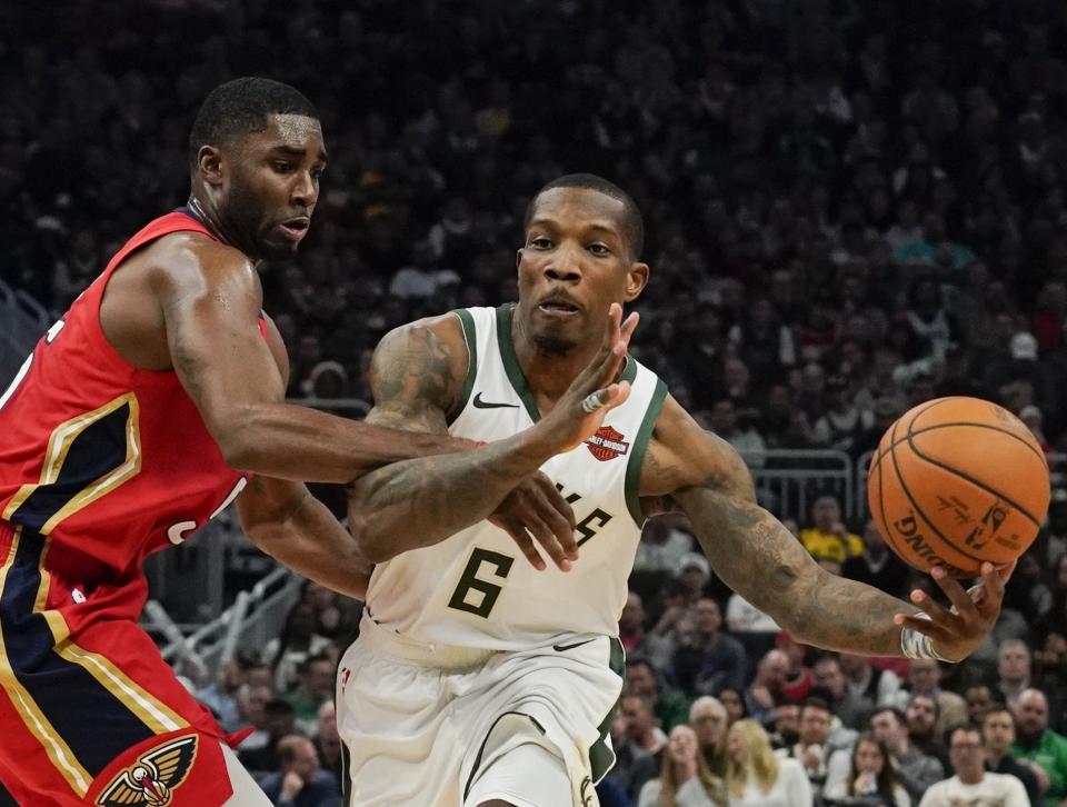 Milwaukee Bucks' Eric Bledsoe is fouled by New Orleans Pelicans' E'Twaun Moore during the second half of an NBA basketball game Wednesday, Dec. 19, 2018, in Milwaukee. The Bucks won 123-115. (AP Photo/Morry Gash)