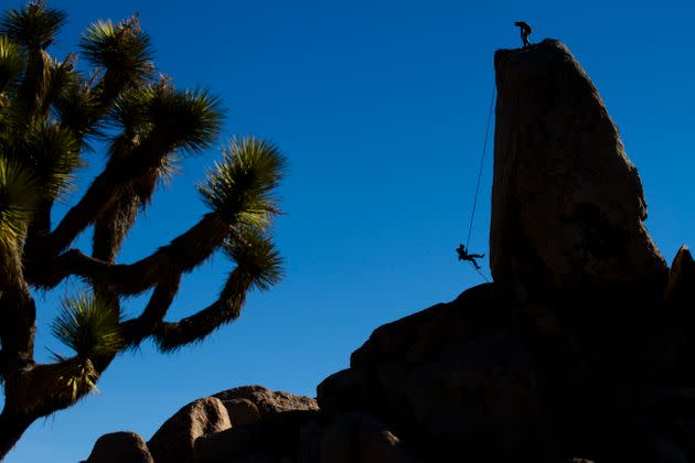 A climber rappels off Headstone Rock in Joshua Tree National Park, California. (Photo: Cavan Images via Getty Images)