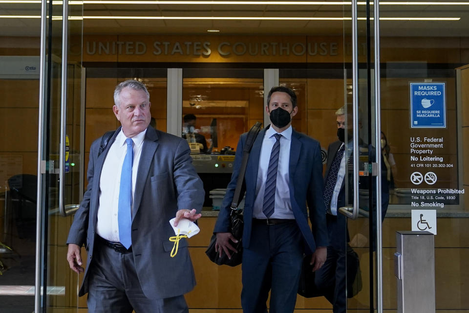 Elliot Peters, left, an attorney representing the PGA Tour, leaves a U.S. courthouse in San Jose, Calif., Tuesday, Aug. 9, 2022. A federal judge ruled that three golfers who joined Saudi-backed LIV Golf will not be able to compete in the PGA Tour's postseason. (AP Photo/Godofredo A. Vásquez)