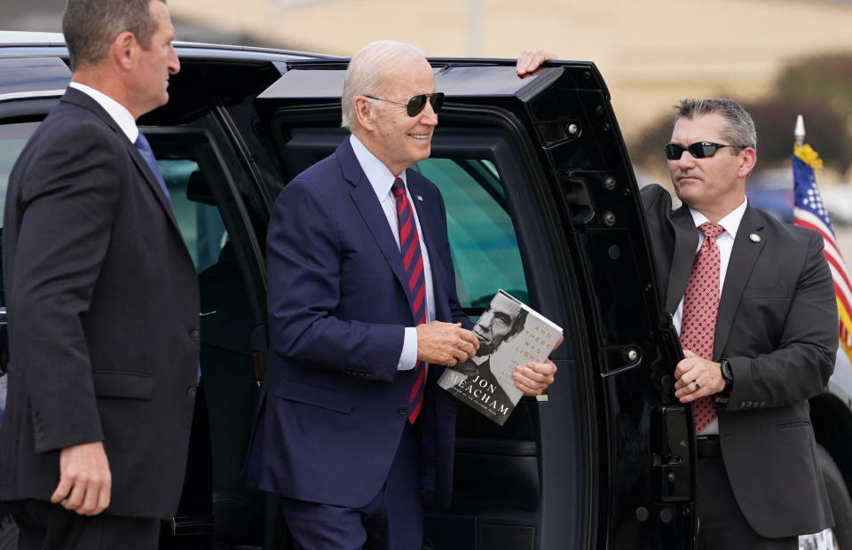 President Biden holding Jon Meacham’s book on Abraham Lincoln.