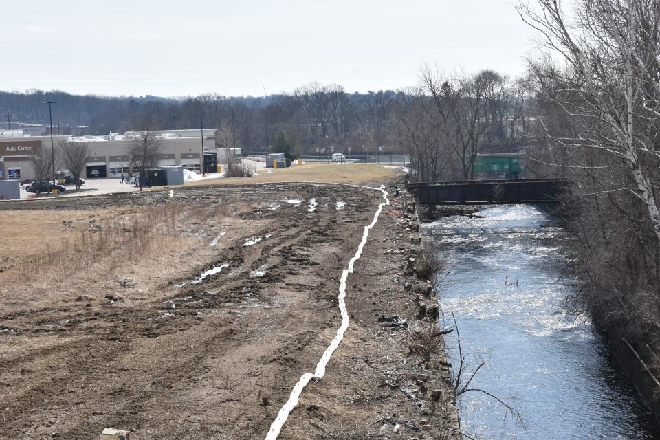 An area adjacent to Walmart on Tobias Boland Way and along the Blackstone River was clear-cut in fall 2021 as homeless encampments in the are were being removed.