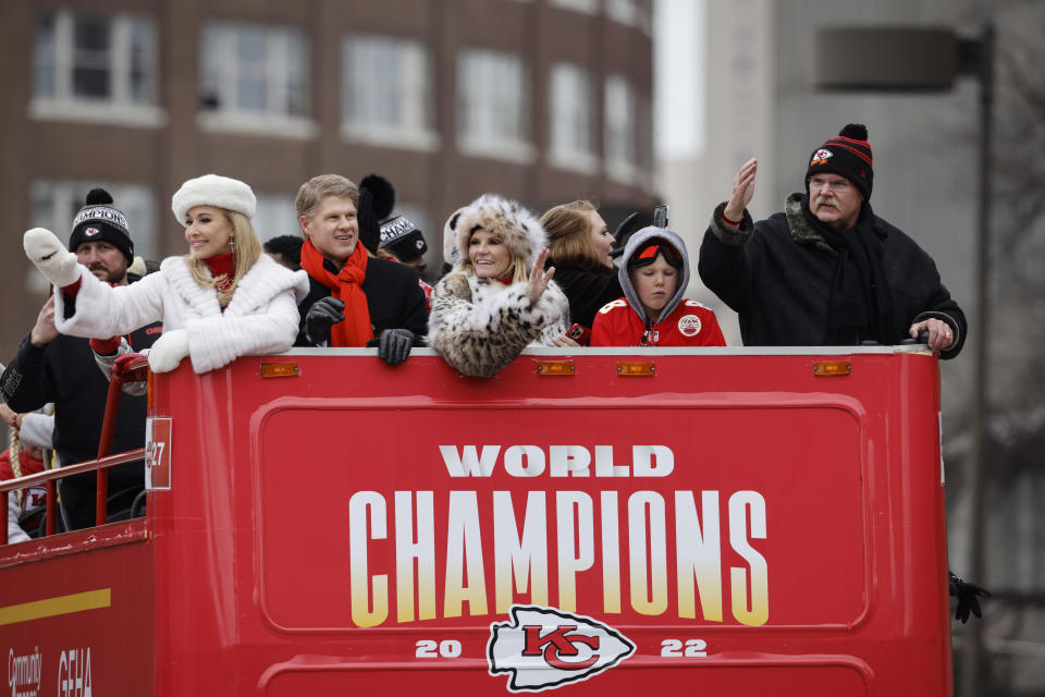 Kansas City Chiefs owner Clark Hunt, second left, and head coach Andy Reid, right, take part in the NFL football team's victory celebration and parade in Kansas City, Mo., Wednesday, Feb. 15, 2023, following the Chiefs' win over the Philadelphia Eagles Sunday in the NFL Super Bowl 57 football game. (AP Photo/Colin E. Braley)