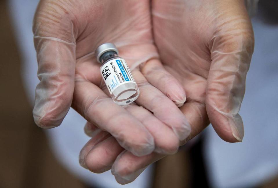 Dr. Dhruti Patel holds a vial of the the Janssen COVID-19 vaccine at Lexington Pharmacy on Thursday, March 18, 2021. The pharmacy is administering the Johnson and Johnson coronavirus vaccine, which is one shot as opposed to the two shot vaccines made by other drug companies.