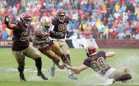 San Francisco and Washington play on a water-logged pitch - Credit: USA TODAY SPORTS