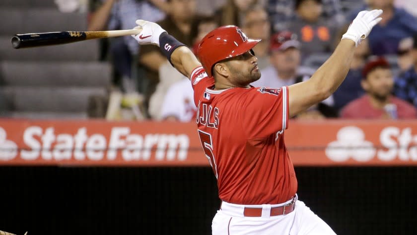 Angels slugger Albert Pujols hits a double during the second inning of Tuesday's win over the Houston Astros.