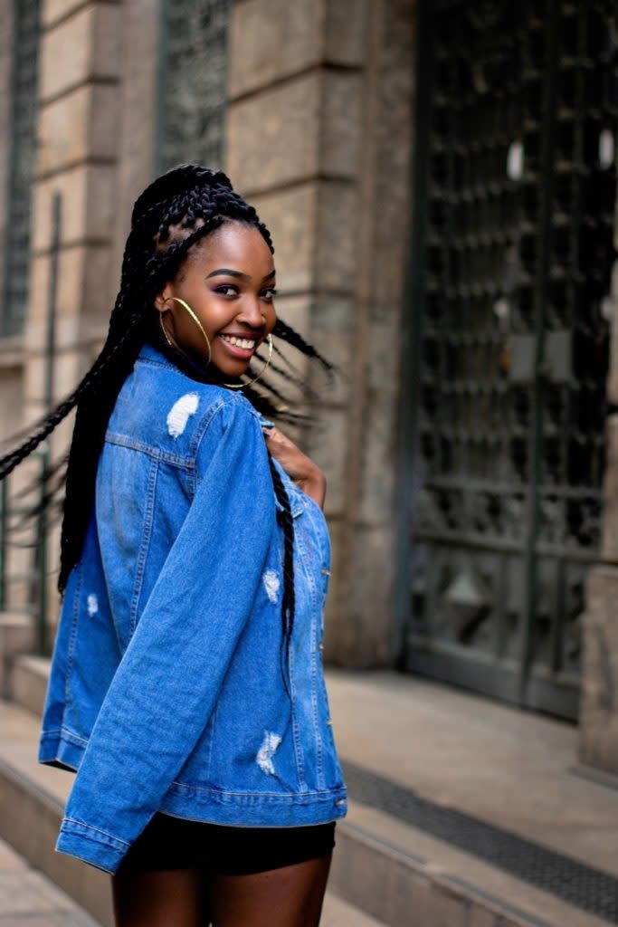 Black woman wearing jean jacket