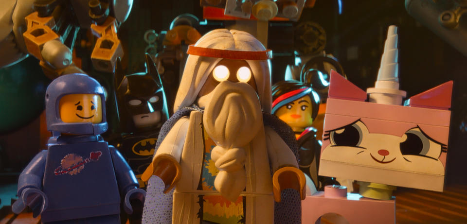 This image released by Warner Bros. Pictures shows characters, from left, Benny, voiced by Charlie Day, Batman, voiced by Will Arnett, Vitruvius, voiced by Morgan Freeman, Wyldstyle, voiced by Elizabeth Banks and Unikitty, voiced by Alison Brie, in a scene from "The Lego Movie." (AP Photo/Warner Bros. Pictures)