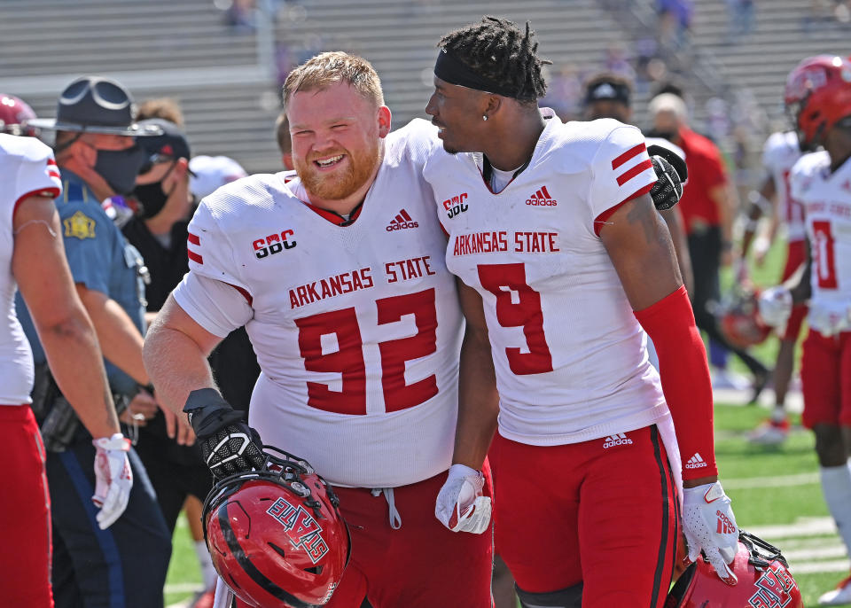 MANHATTAN, KS - SEPTEMBER 12:  Defensive lineman Forrest Merrill #92 of the Arkansas State Red Wolves and wide receiver Jonathan Adams Jr. #9, react after beating the Kansas State Wildcats at Bill Snyder Family Football Stadium on September 12, 2020 in Manhattan, Kansas. (Photo by Peter Aiken/Getty Images)