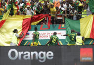 Mali's Ibrahima Kone, centre, celebrates with teammates and fans after scoring his team's first goal, during the African Cup of Nations 2022 group F soccer match between Gambia and Mali at Omnisport Stadium, in Limbe, Cameroon, Sunday, Jan. 16, 2022. (AP Photo/Sunday Alamba)