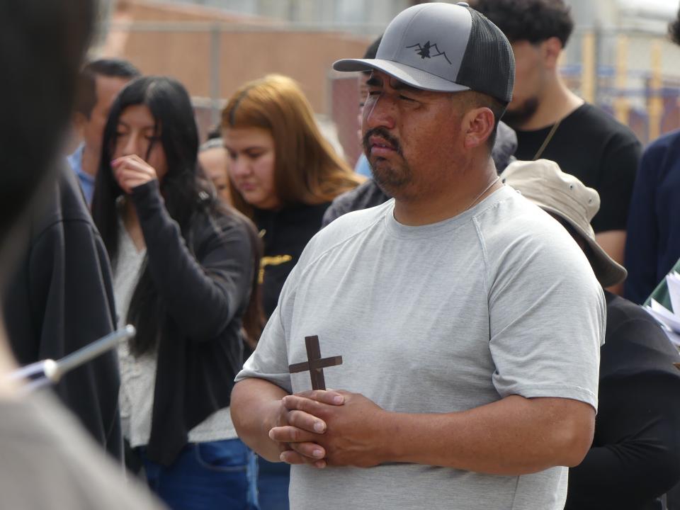 Hundreds of Good Friday worshipers observed the Stations of the Cross outside of St. Joan of Arc Catholic Church in Victorville.