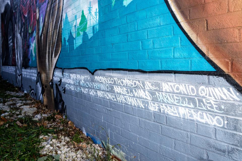 The names of Des Moines area victims of gun violence are seen lining a mural at Creative Visions on Thursday, Nov. 2, 2023, in Des Moines.
